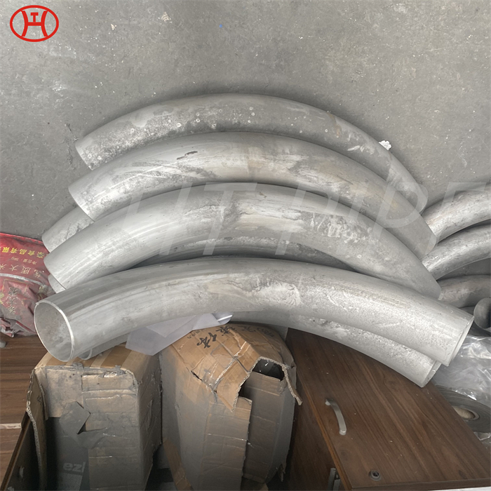 Hastelloy B2 pipe bend in the chemical process industry involving sulfuric phosphoric hydrochloric and acetic acid